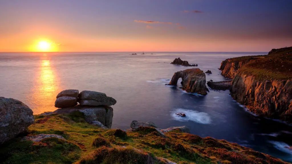 Autumn sunset over Land's End, Longships and the islands of the Armed Knight and Enys Dodnan, Cornwall, UK